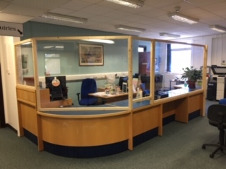 Front desk with protective screens to make the library covid-safe